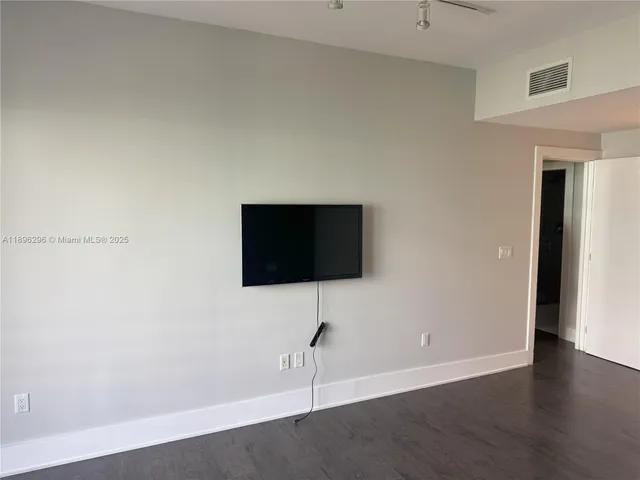 a living room with a flat screen tv