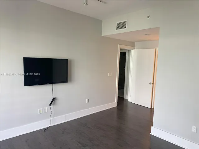 a view of a livingroom with a flat screen tv