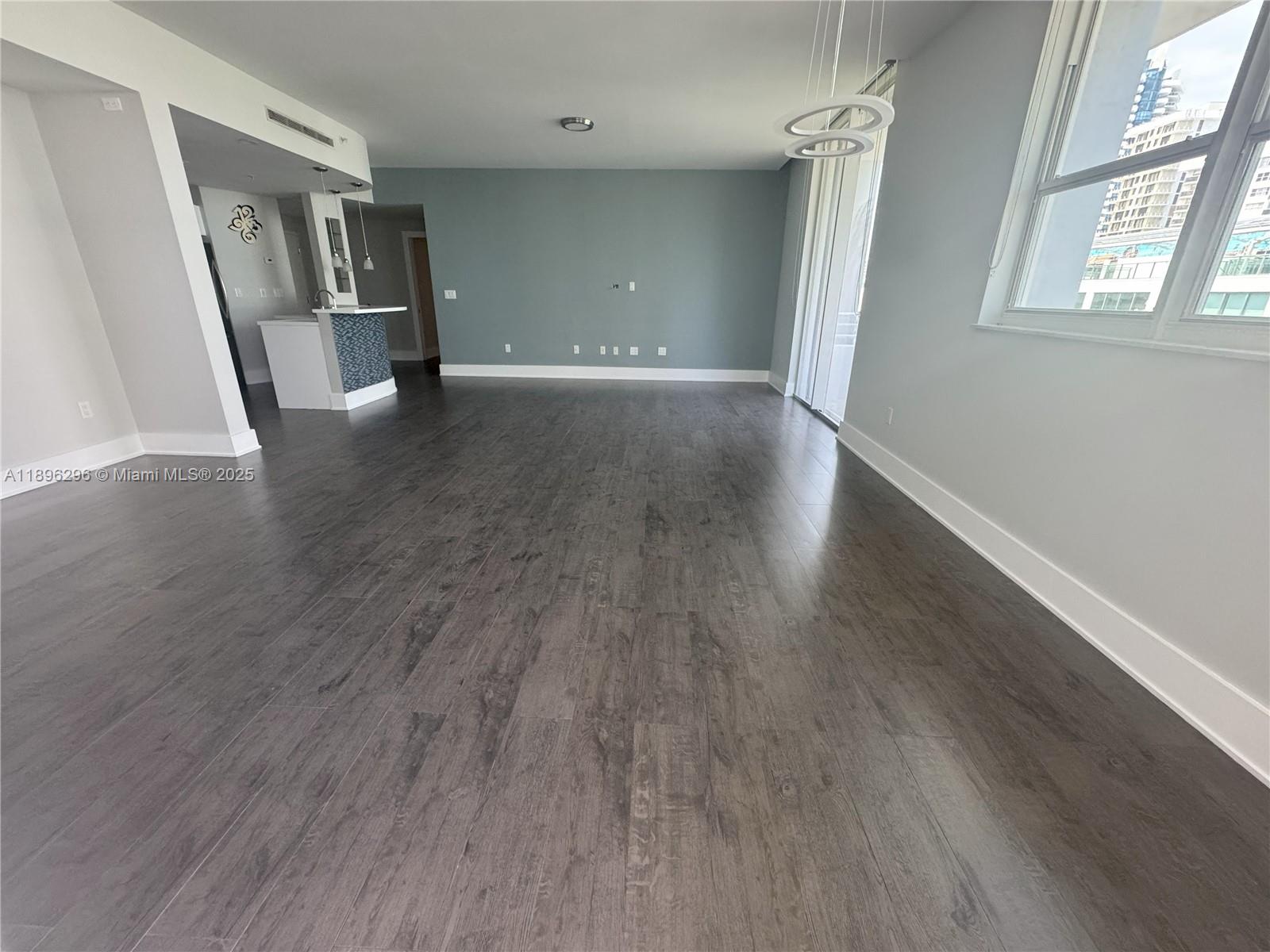 5970 Indian Creek Drive, Unit PH3 Miami Beach, FL 33140 - Photo 2 of 37 a view of a livingroom with wooden floor and stairs