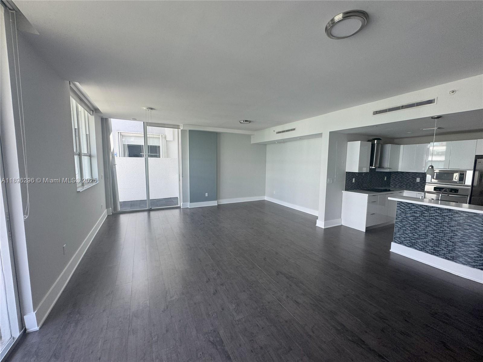 5970 Indian Creek Drive, Unit PH3 Miami Beach, FL 33140 - Photo 21 of 37 a view of kitchen and wooden floor