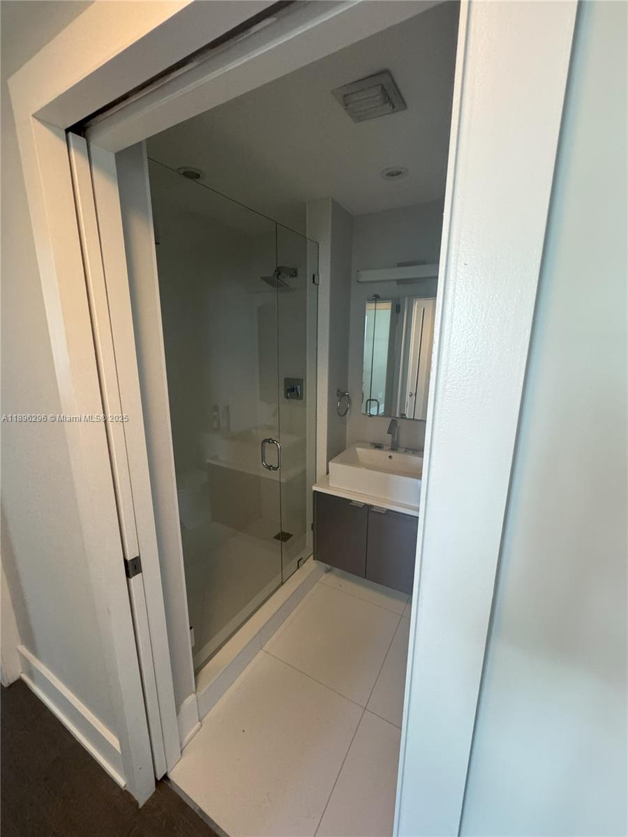 5970 Indian Creek Drive, Unit PH3 Miami Beach, FL 33140 - Photo 24 of 37 a bathroom with a shower and a sink