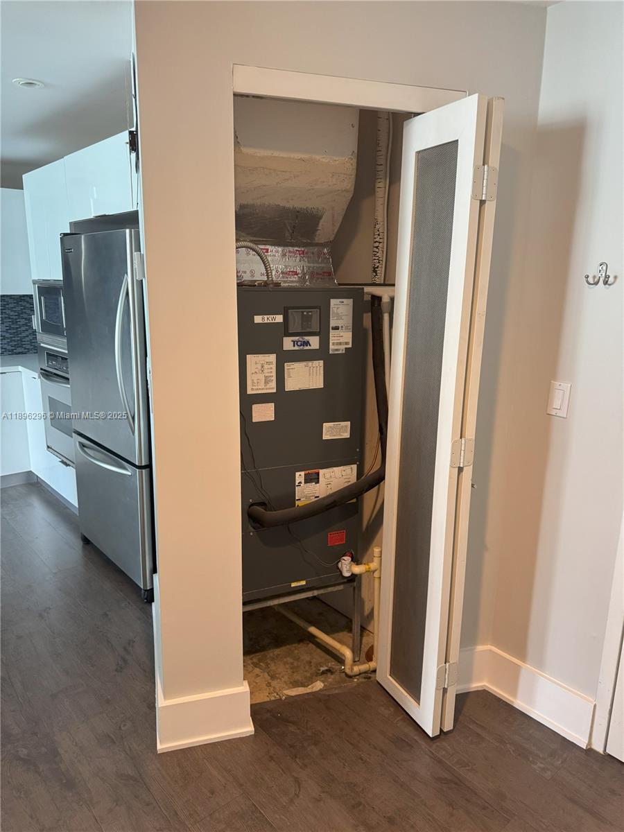 5970 Indian Creek Drive, Unit PH3 Miami Beach, FL 33140 - Photo 26 of 37 a view of a kitchen with a refrigerator and an empty room