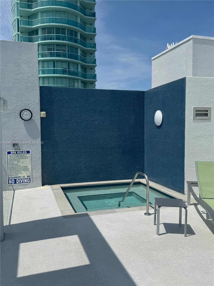 5970 Indian Creek Drive, Unit PH3 Miami Beach, FL 33140 - Photo 32 of 37 a bathroom with a sink and a mirror
