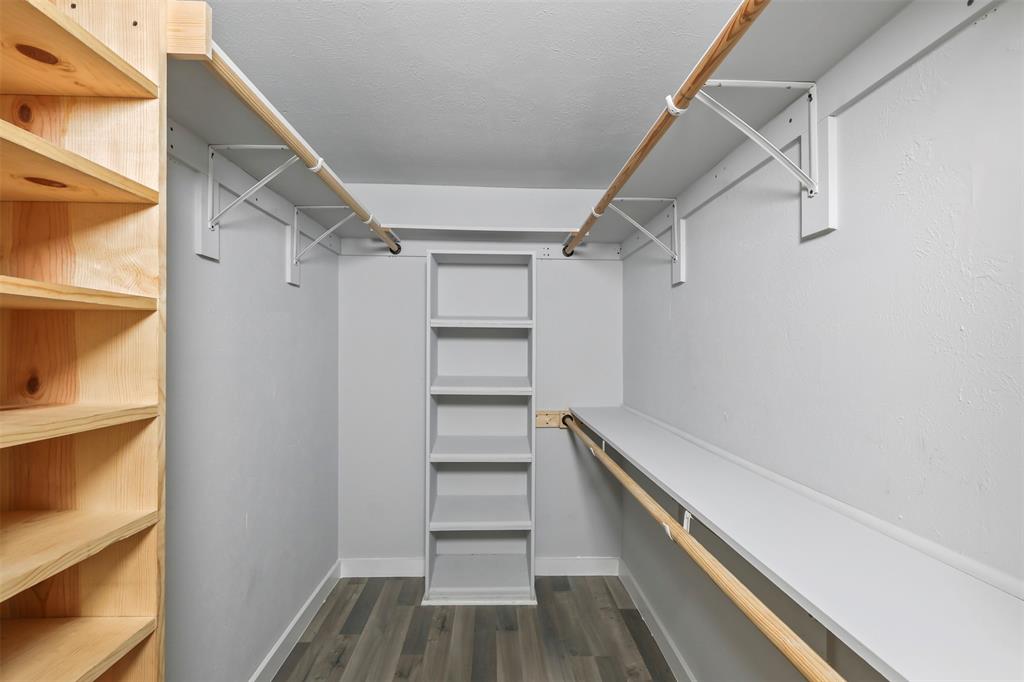 10526 Stone Canyon Road, Unit 201 Dallas, TX 75230 - Photo 14 of 28 a view of walk in closet with empty racks