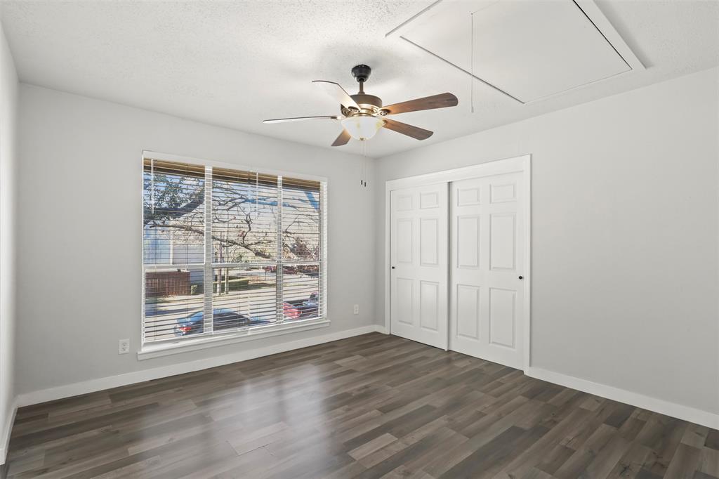 10526 Stone Canyon Road, Unit 201 Dallas, TX 75230 - Photo 16 of 25 wooden floor in an empty room with a window