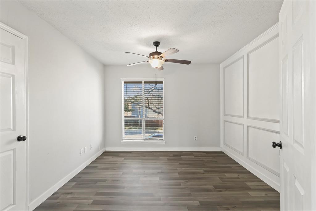 10526 Stone Canyon Road, Unit 201 Dallas, TX 75230 - Photo 18 of 25 wooden floor in an empty room with a window