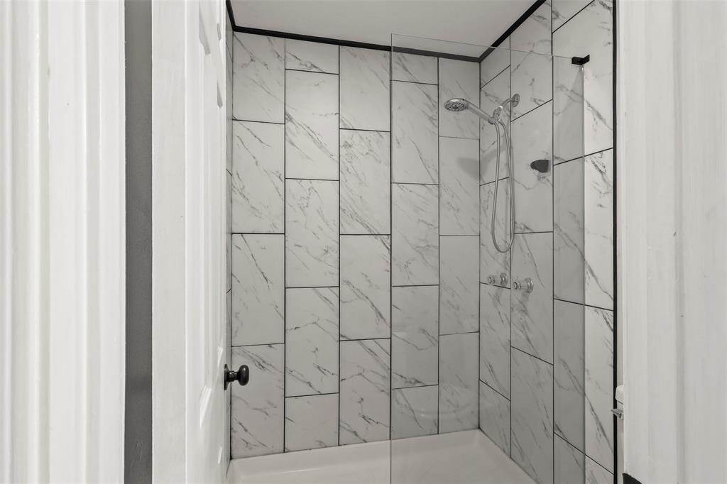 10526 Stone Canyon Road, Unit 201 Dallas, TX 75230 - Photo 19 of 28 a bathroom with a shower
