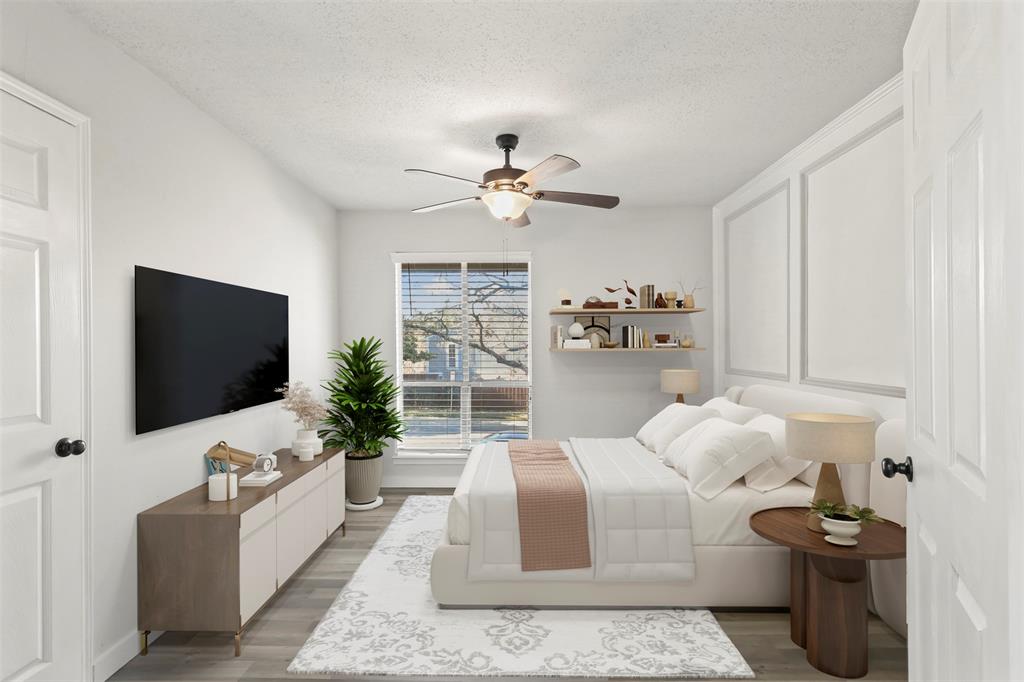 10526 Stone Canyon Road, Unit 201 Dallas, TX 75230 - Photo 20 of 28 a living room with furniture and a flat screen tv