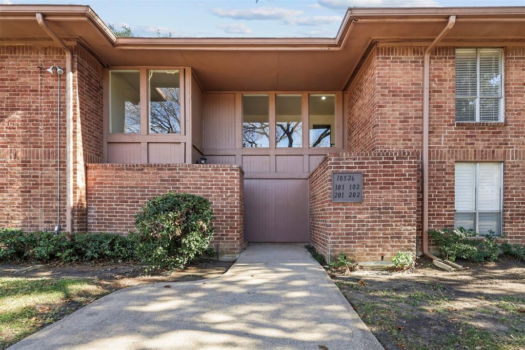10526 Stone Canyon Road, Unit 201 Dallas, TX 75230 - Photo 25 of 25 a front view of a house