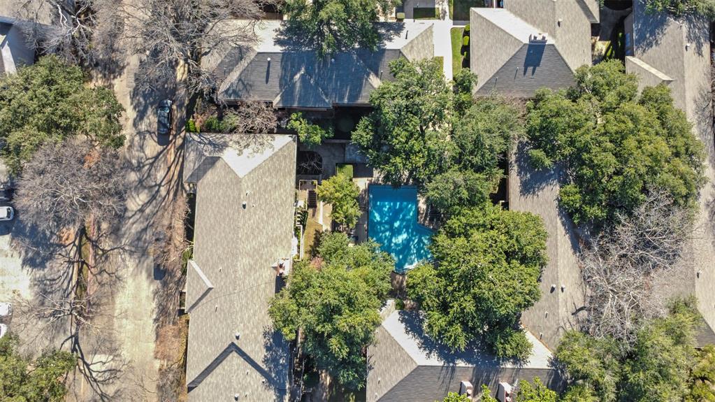 10526 Stone Canyon Road, Unit 201 Dallas, TX 75230 - Photo 26 of 28 an aerial view of a house with yard and outdoor seating