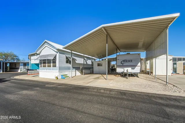 a blue and white house with a outdoor space