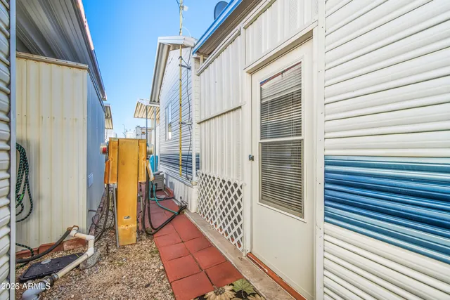 a room with lots of furniture and a wooden floor