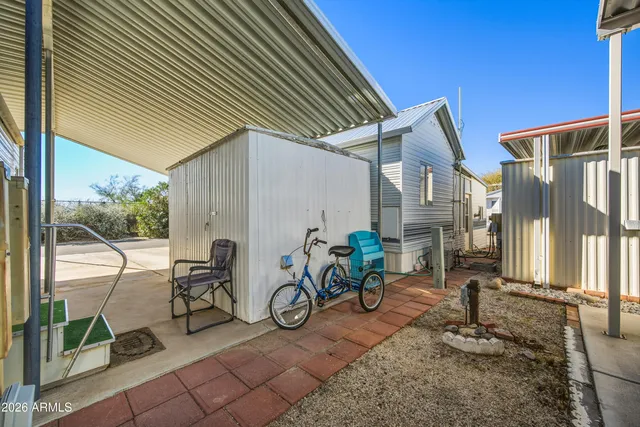 a view of a backyard with large trees