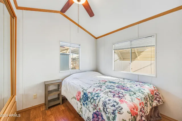 a view of a patio with table and chairs under an umbrella