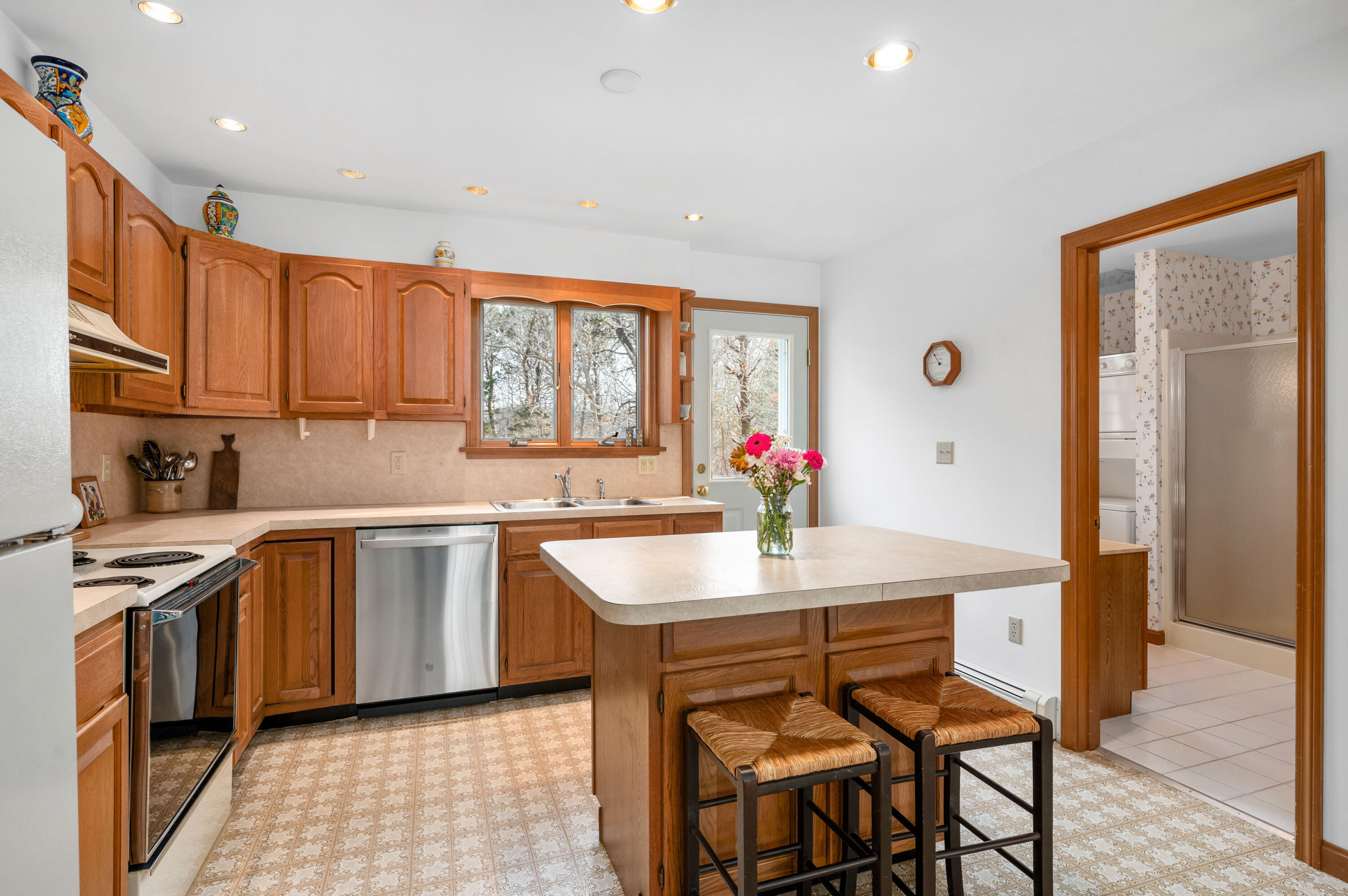 55 Bow Road Eastham, MA 02642 - Photo 11 of 44 a kitchen with granite countertop sink cabinets and stainless steel appliances