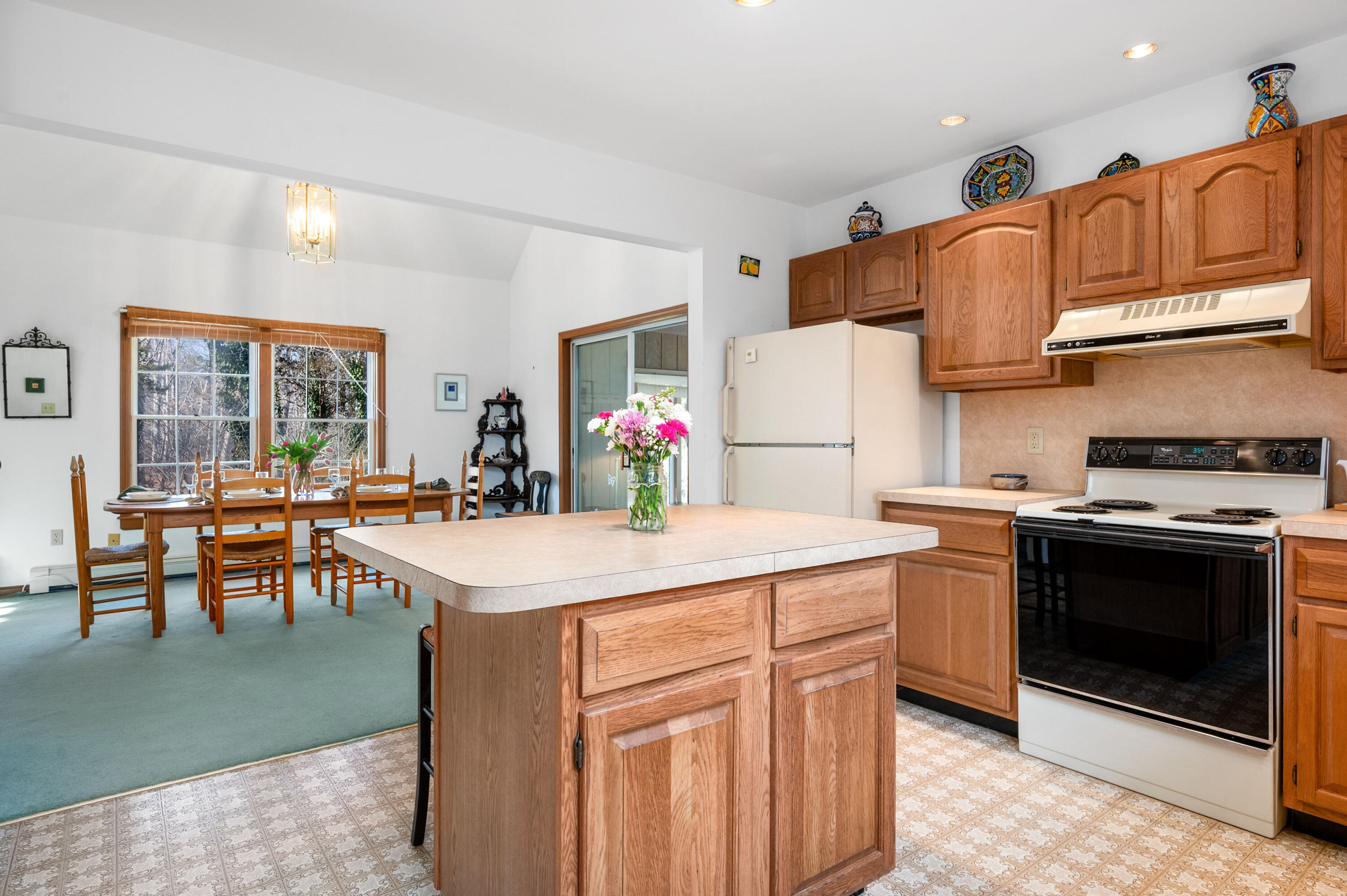 55 Bow Road Eastham, MA 02642 - Photo 14 of 44 a kitchen with stainless steel appliances granite countertop a stove refrigerator sink and cabinets