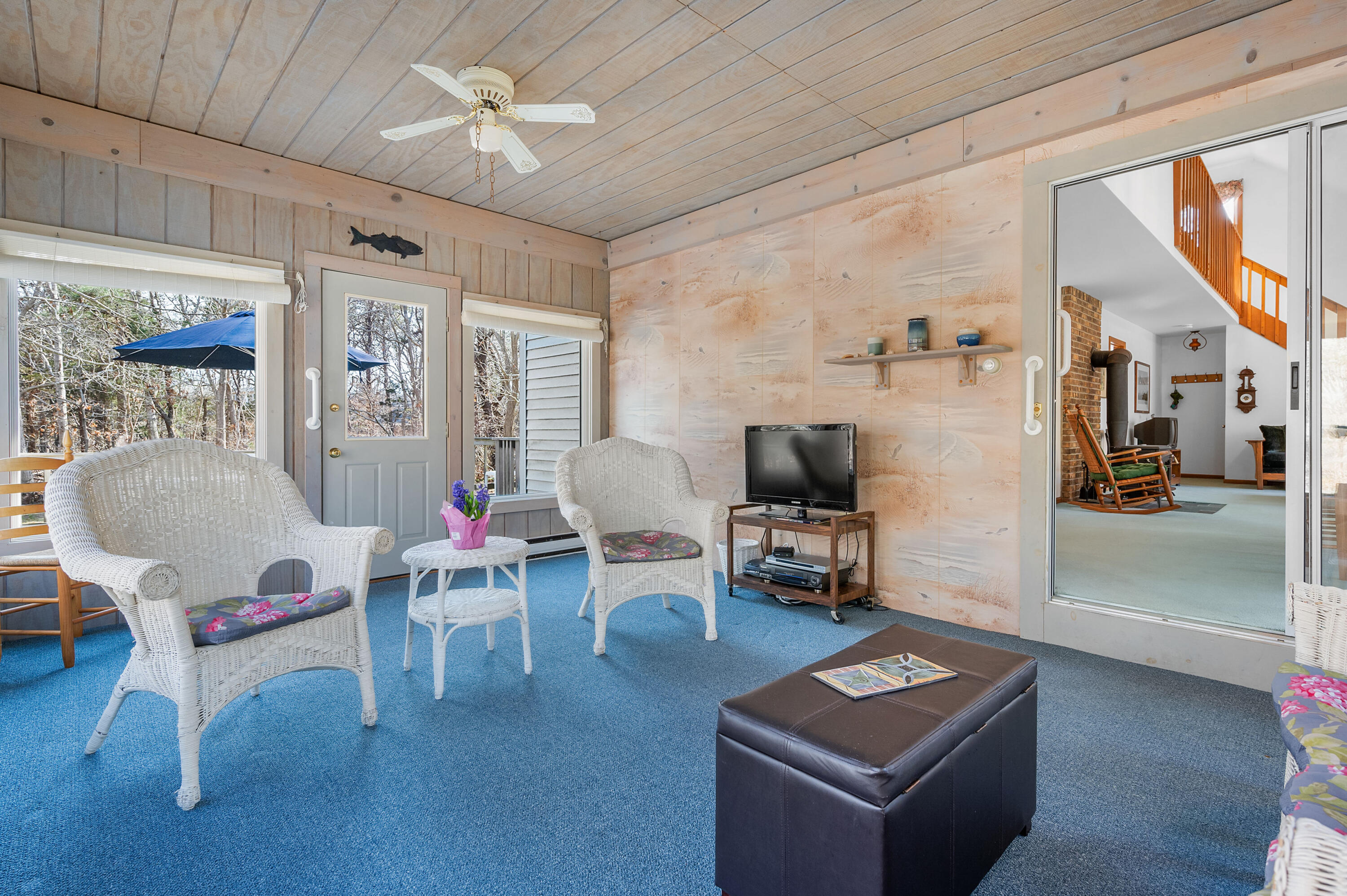 55 Bow Road Eastham, MA 02642 - Photo 16 of 44 a living room with furniture and a flat screen tv