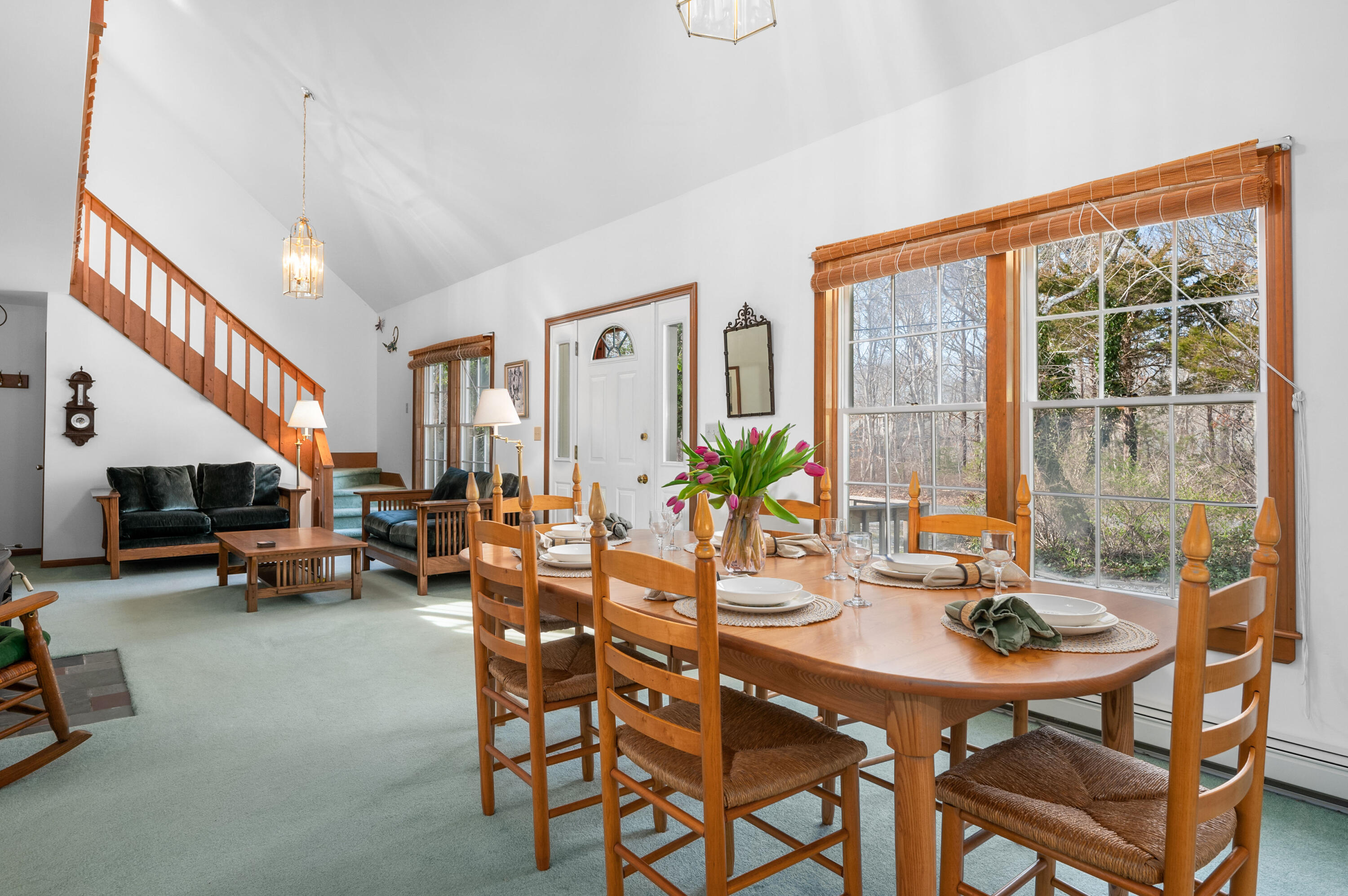 55 Bow Road Eastham, MA 02642 - Photo 19 of 44 a view of a dining room with furniture and a potted plant