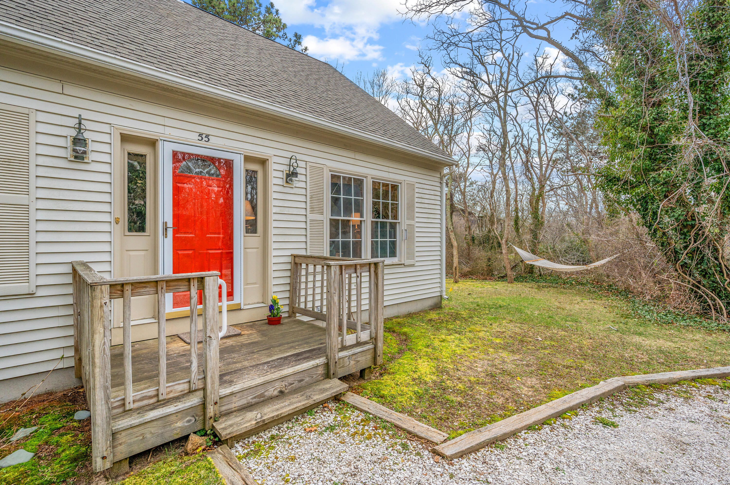 55 Bow Road Eastham, MA 02642 - Photo 2 of 44 a front view of a house with garden