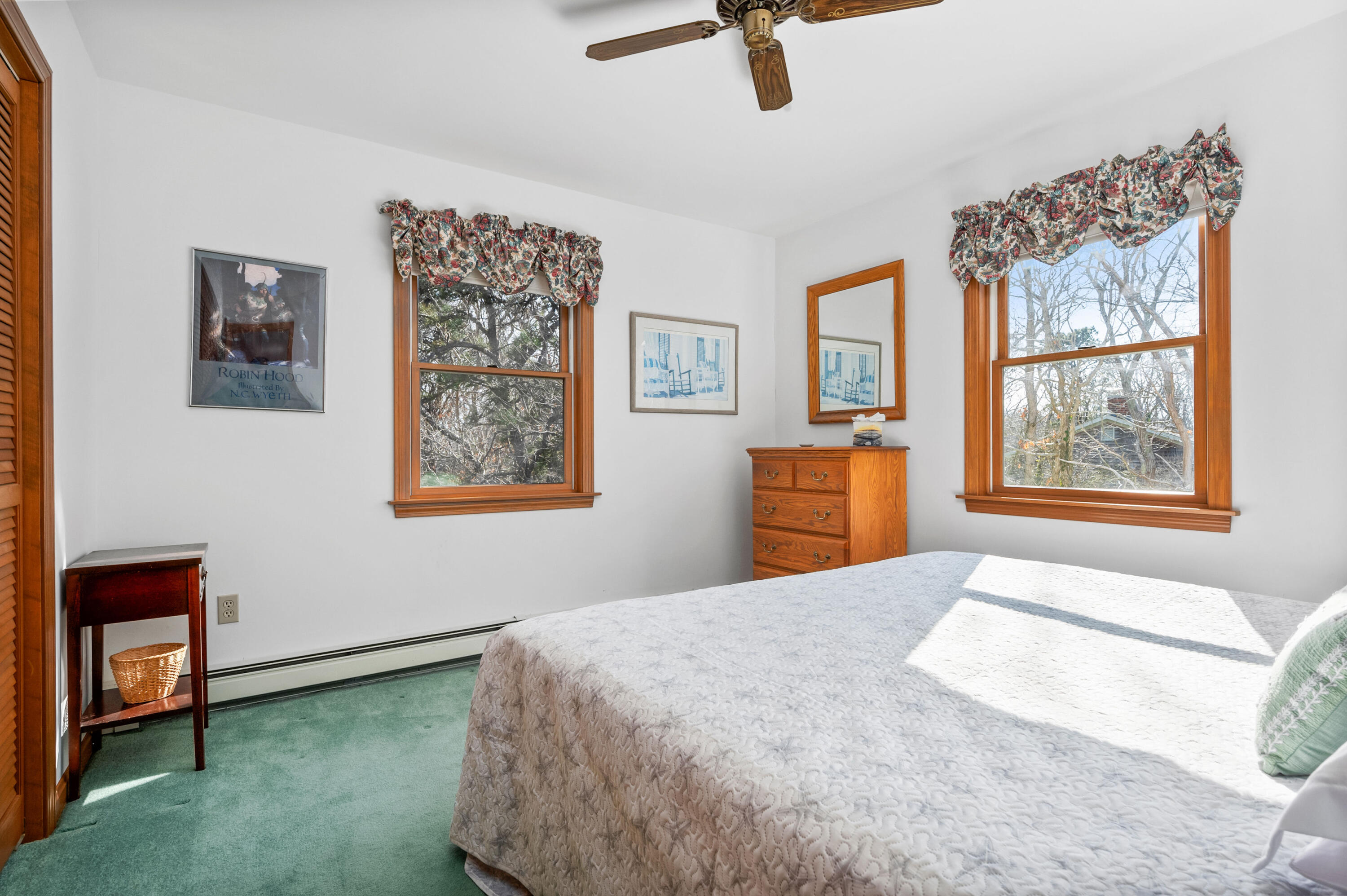 55 Bow Road Eastham, MA 02642 - Photo 24 of 44 a bedroom with a bed and a painting on the wall