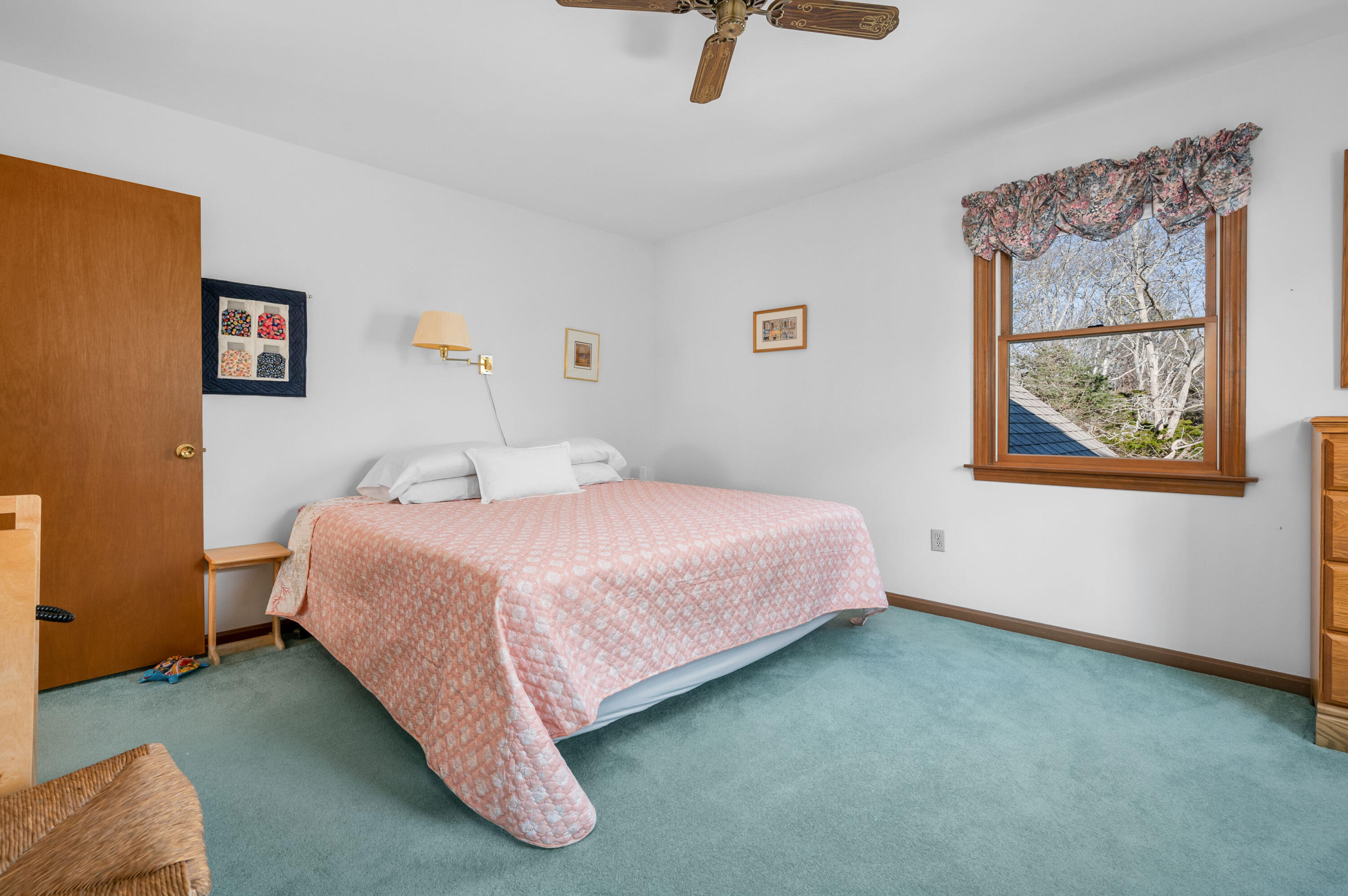 55 Bow Road Eastham, MA 02642 - Photo 28 of 44 a bedroom with a bed and painting on the wall