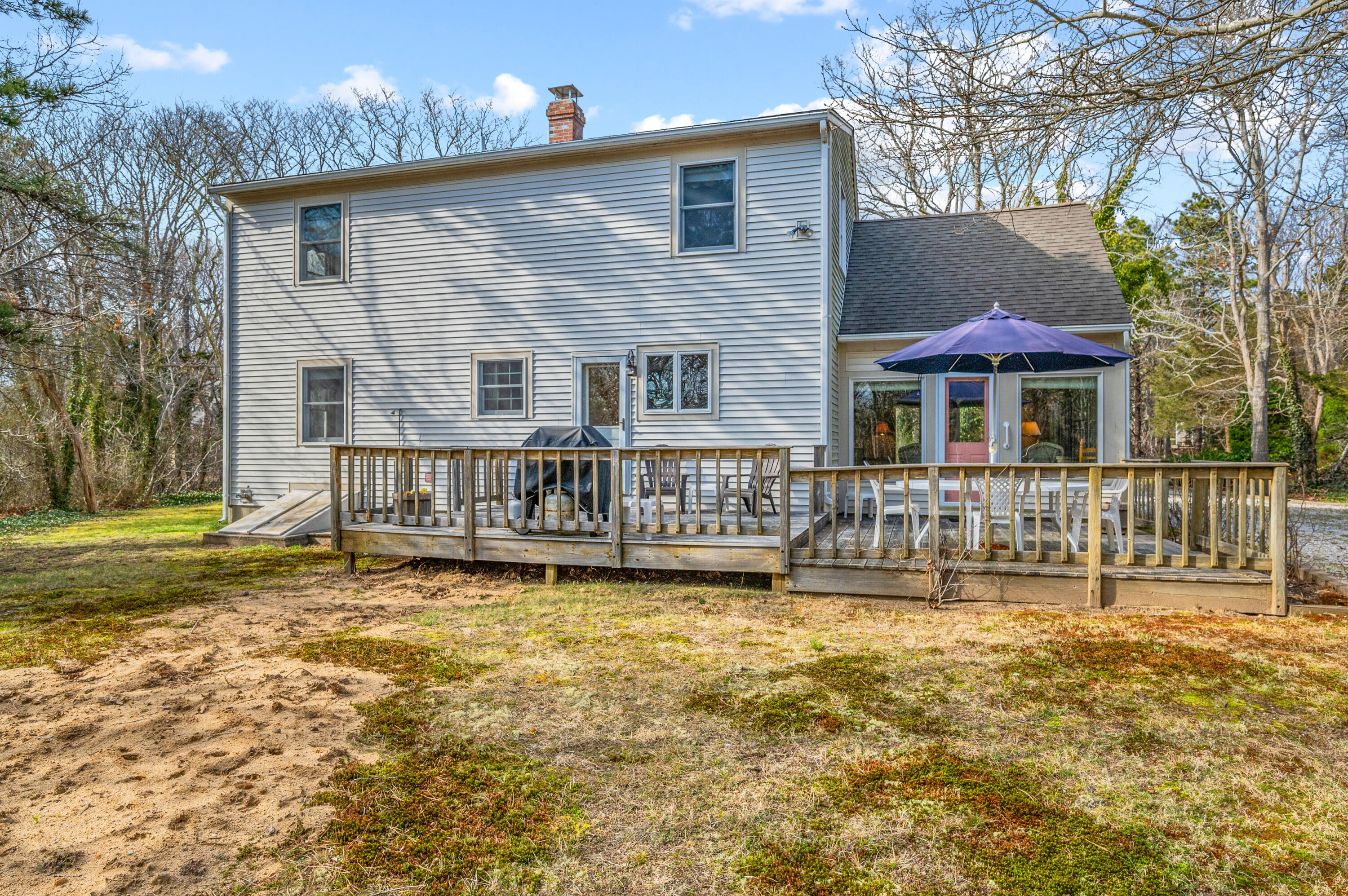 55 Bow Road Eastham, MA 02642 - Photo 32 of 44 a view of a house with pool and chairs next to a yard