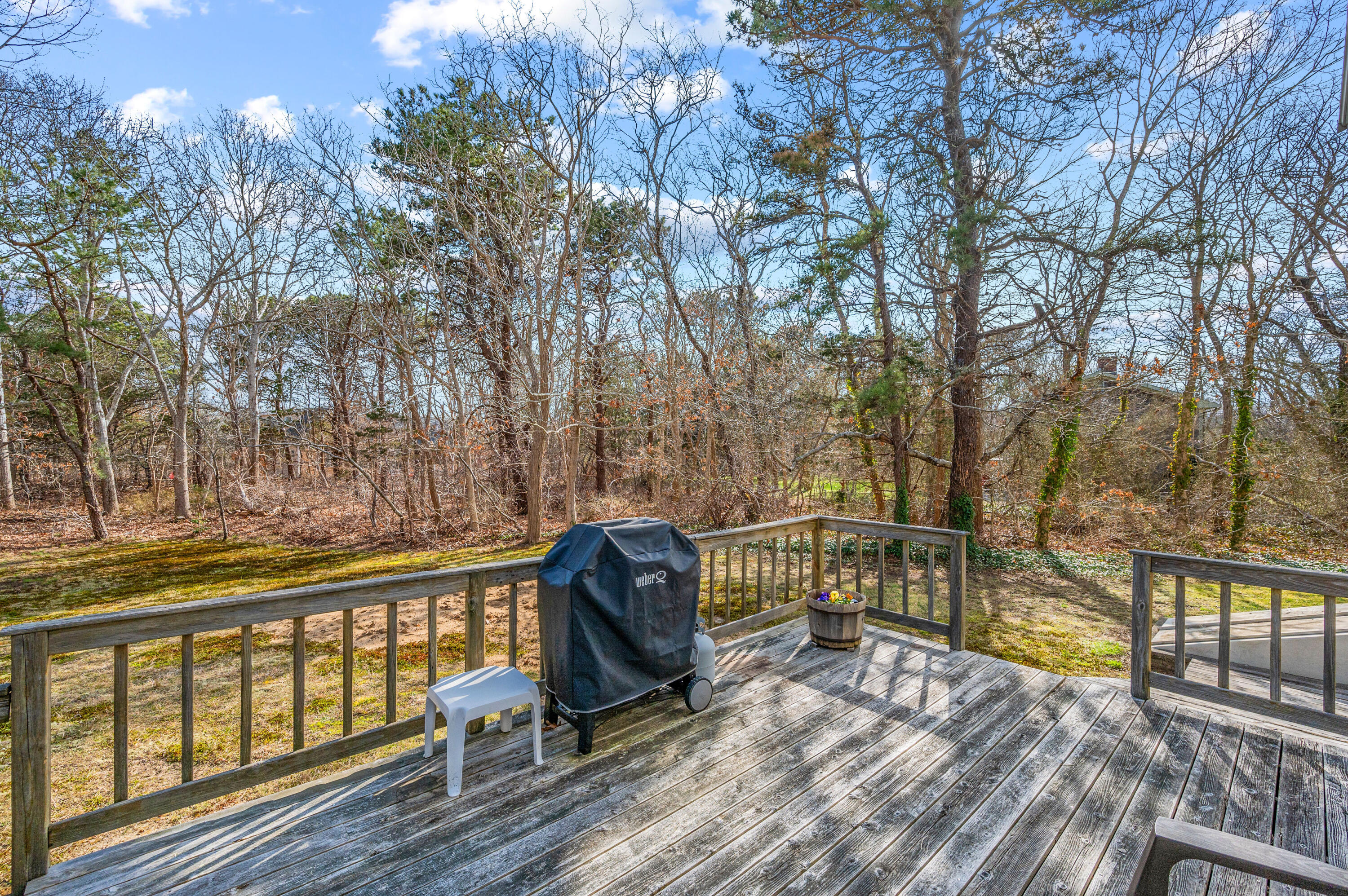 55 Bow Road Eastham, MA 02642 - Photo 38 of 44 a view of a wooden deck with trees
