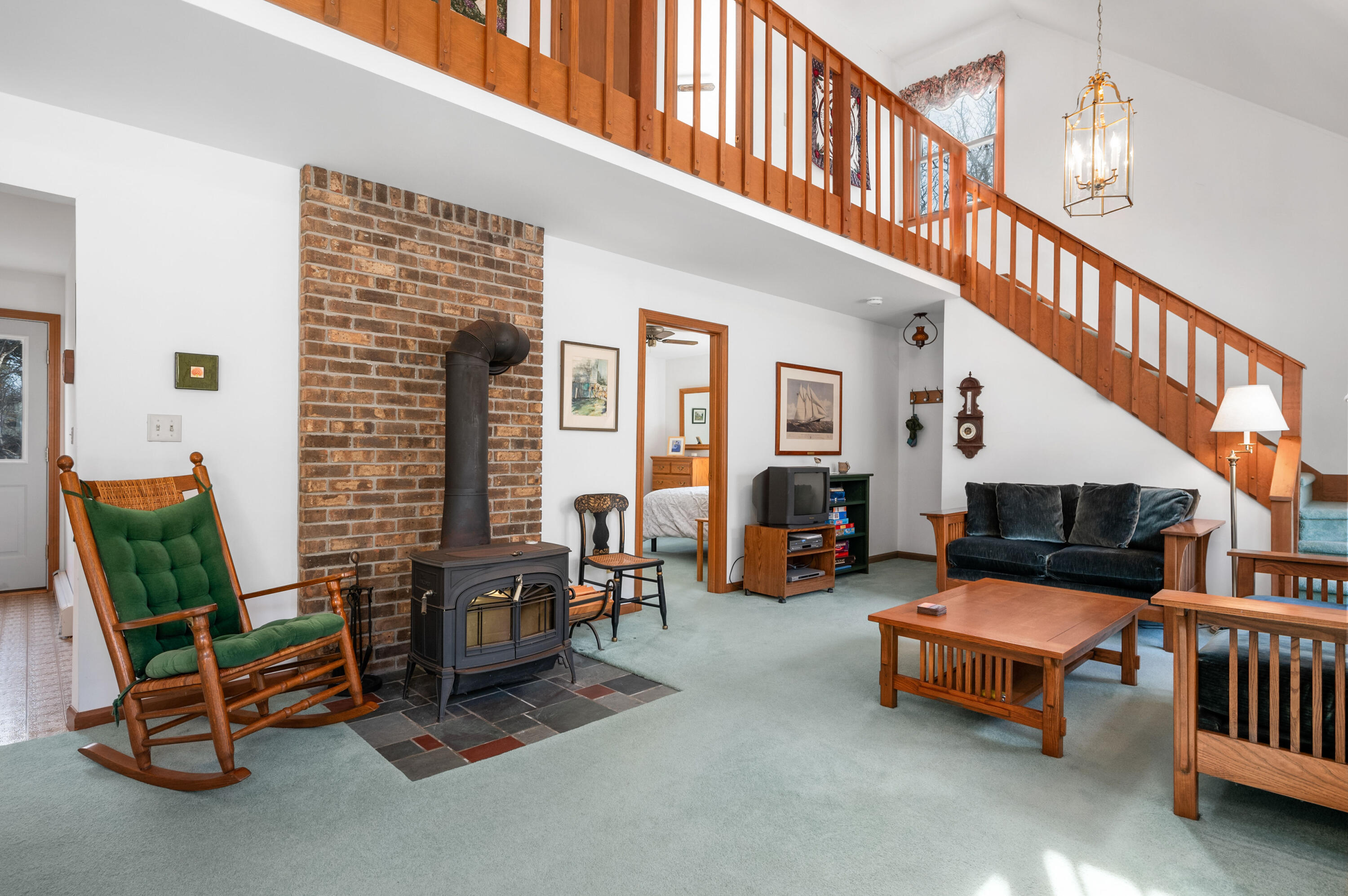 55 Bow Road Eastham, MA 02642 - Photo 5 of 44 a living room with furniture and a dining table with wooden floor