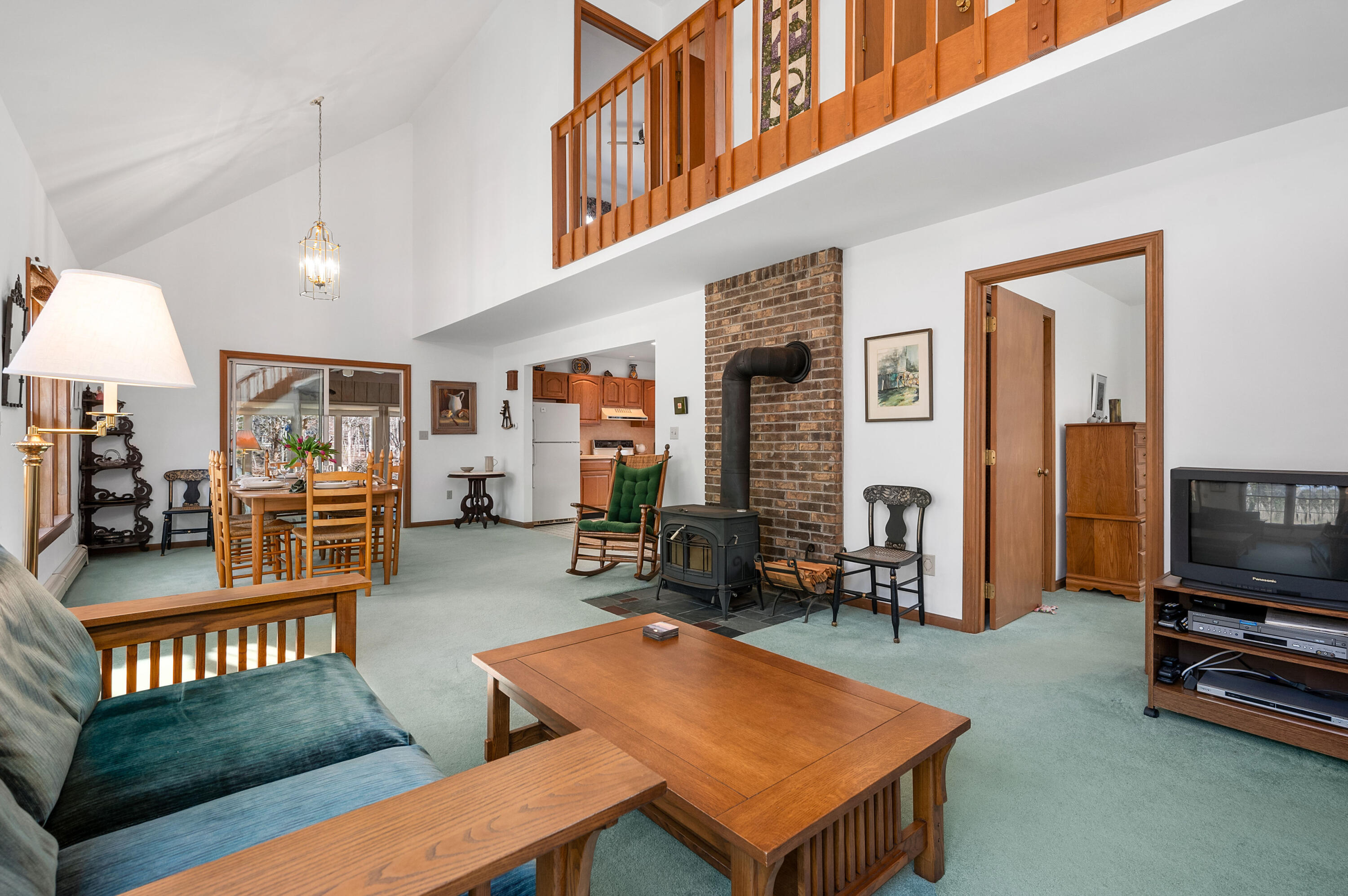 55 Bow Road Eastham, MA 02642 - Photo 6 of 44 a living room with furniture a flat screen tv and kitchen view