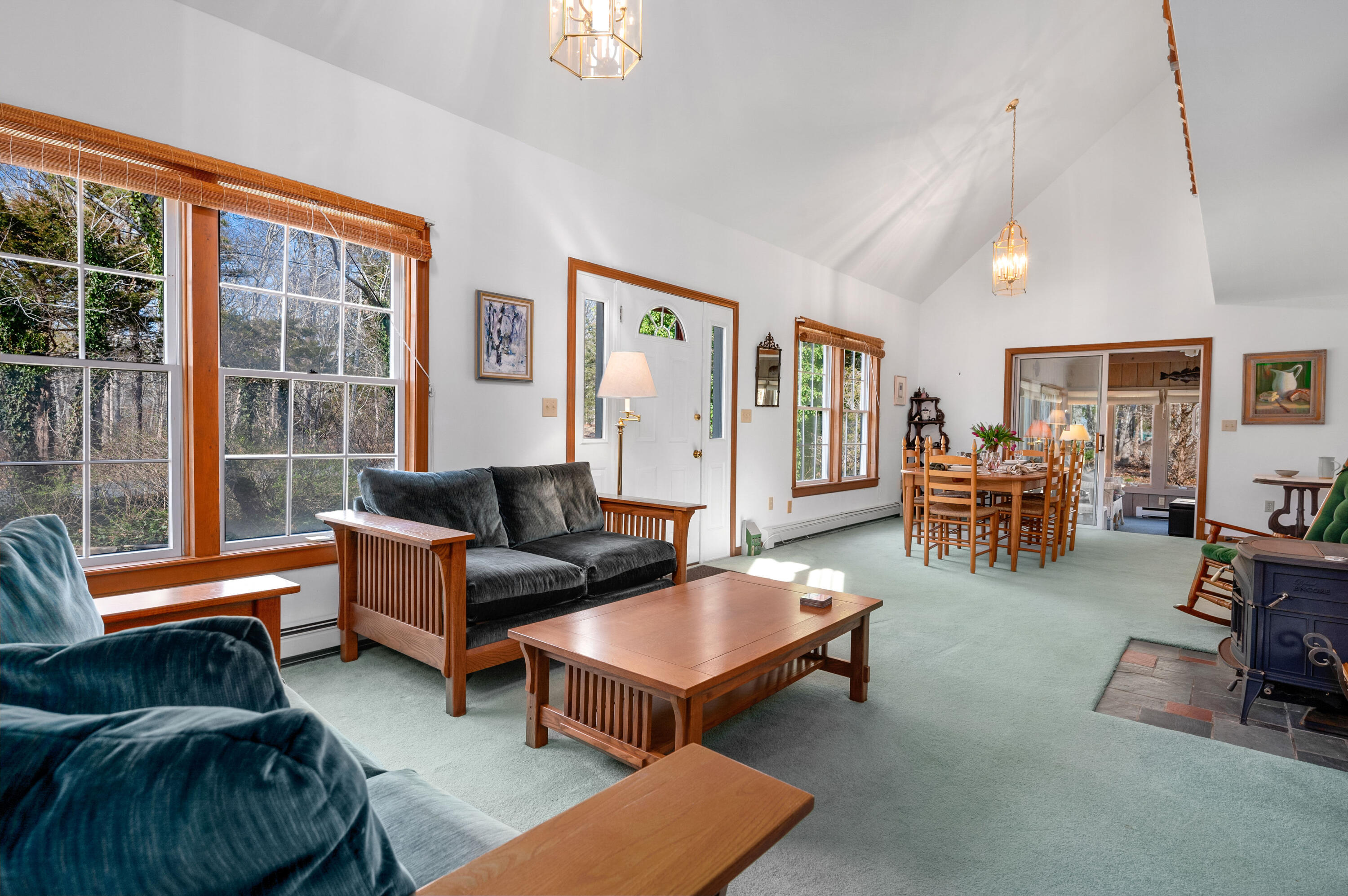 55 Bow Road Eastham, MA 02642 - Photo 7 of 44 a living room with furniture and a table