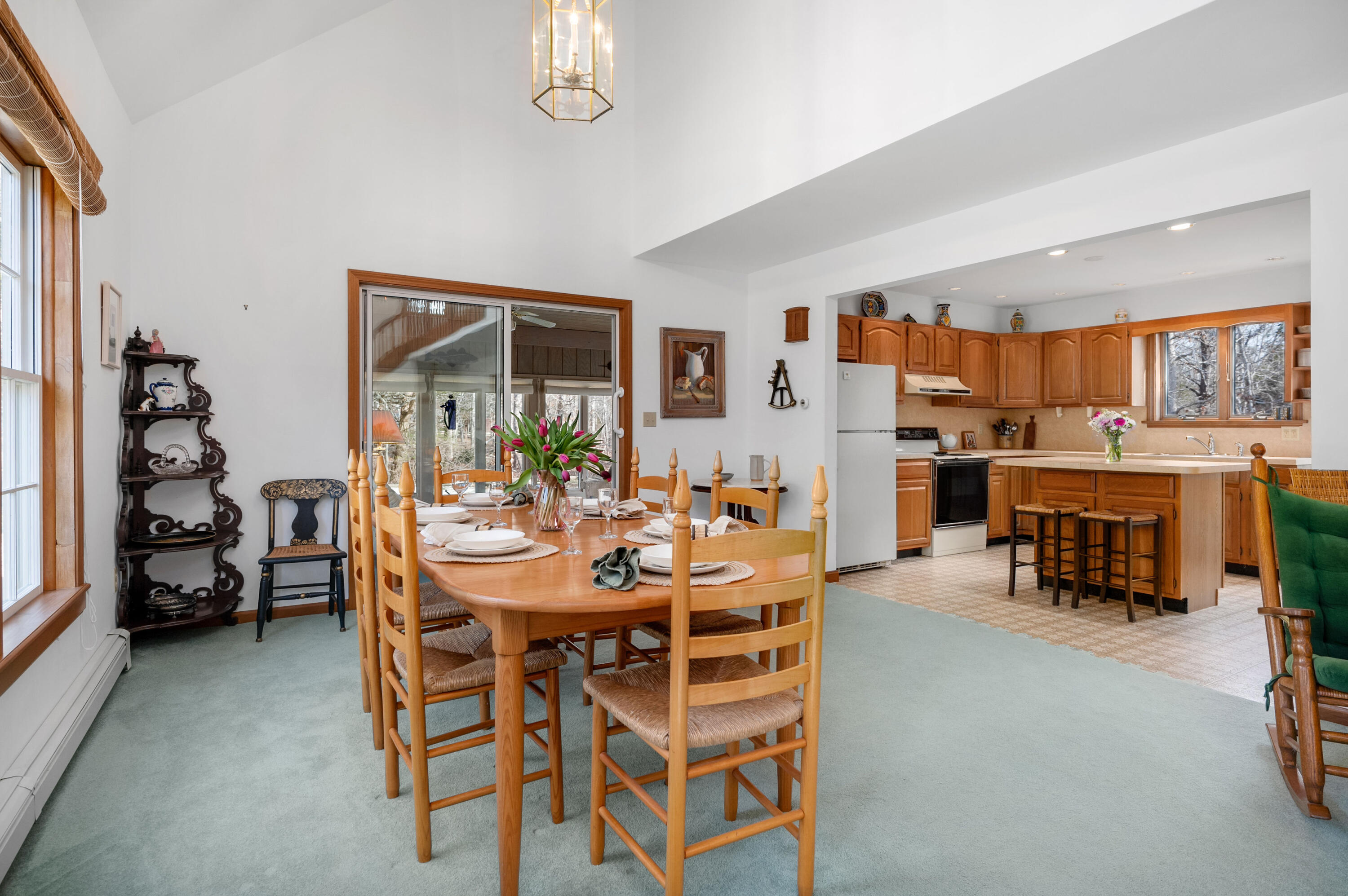 55 Bow Road Eastham, MA 02642 - Photo 8 of 44 a view of a dining room with furniture and a chandelier