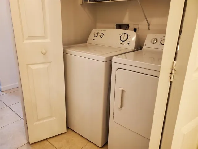 a utility room with dryer and washer
