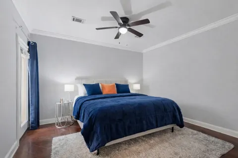 a bedroom with a bed and window