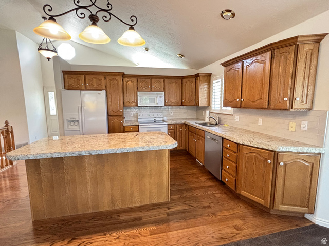 798 South 600 East Payson, UT 84651 - Photo 15 of 31 Kitchen featuring granite-look countertops, wood-finish cabinetry, tile backsplash, and stainless steel appliances