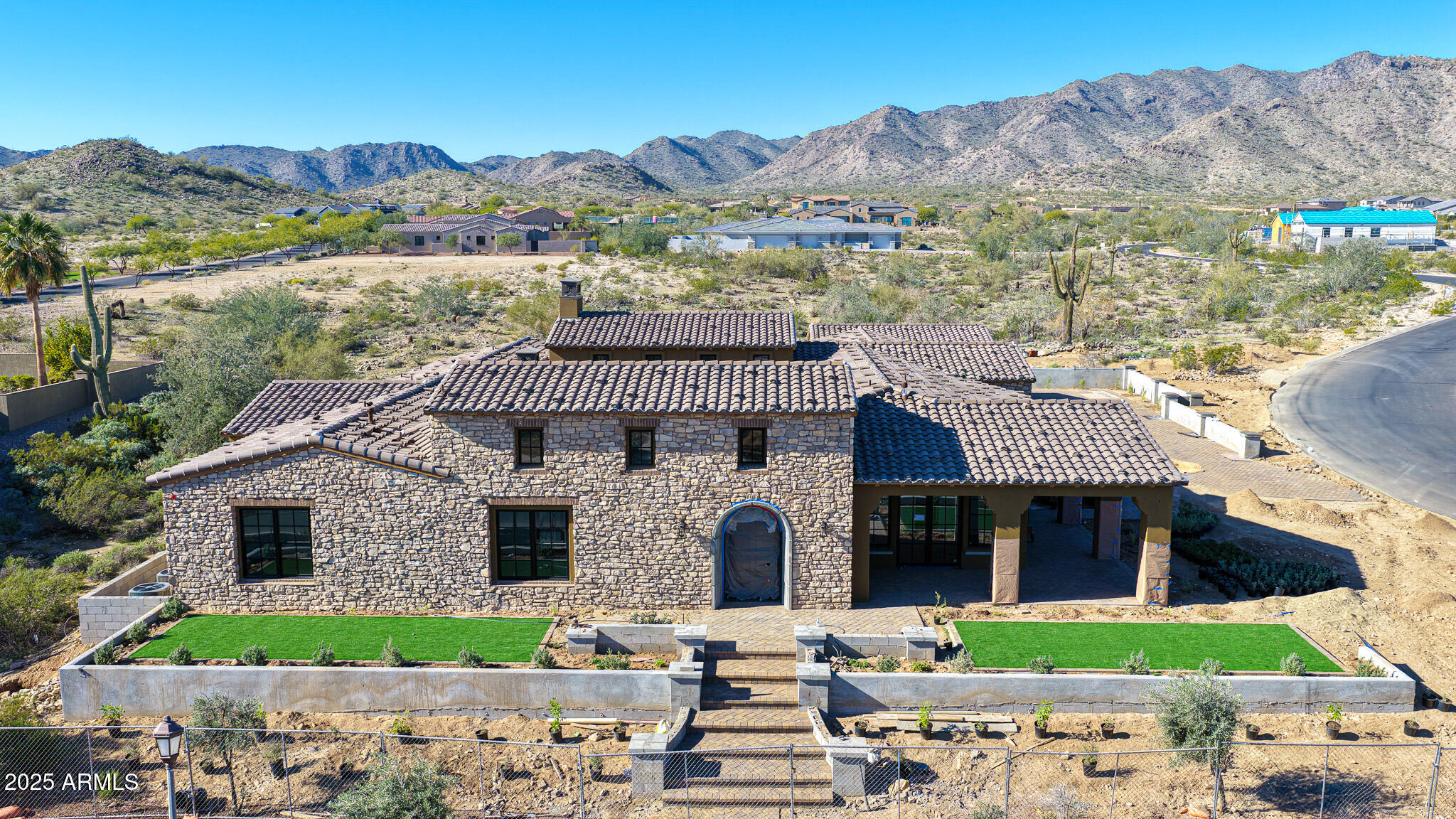 4572 North Regent Street Buckeye, AZ 85396 - Photo 10 of 25 a front view of a house with a garden
