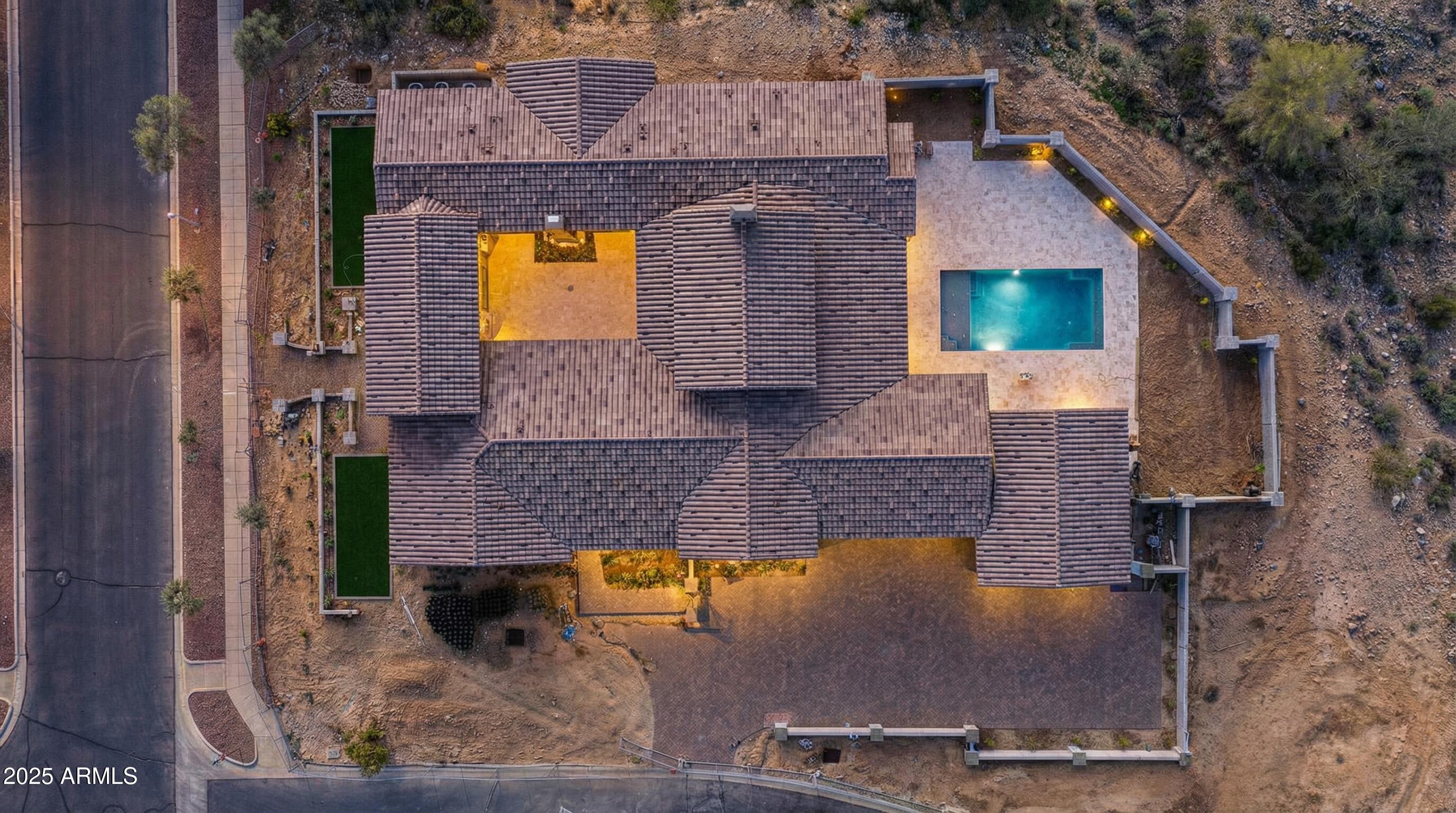 4572 North Regent Street Buckeye, AZ 85396 - Photo 6 of 25 an aerial view of a house with swimming pool and porch