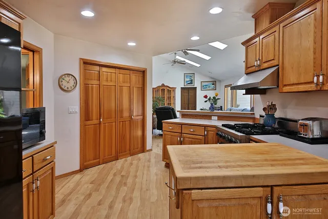 a kitchen with sink and cabinets
