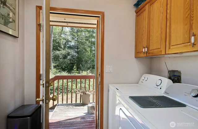 a bedroom with a bed and glass window