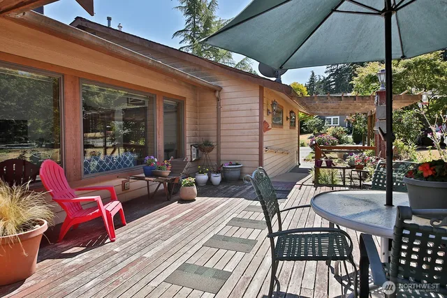 a view of a livingroom with furniture hardwood floor and a window