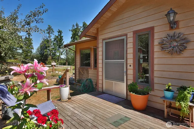 a living room with dining room and wooden floor