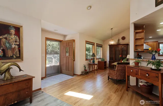 a view of a dining room with furniture window and outside view