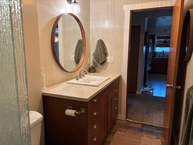 2130 Umpqua Road Woodburn, OR 97071 - Photo 14 of 21 a bathroom with a sink and a mirror