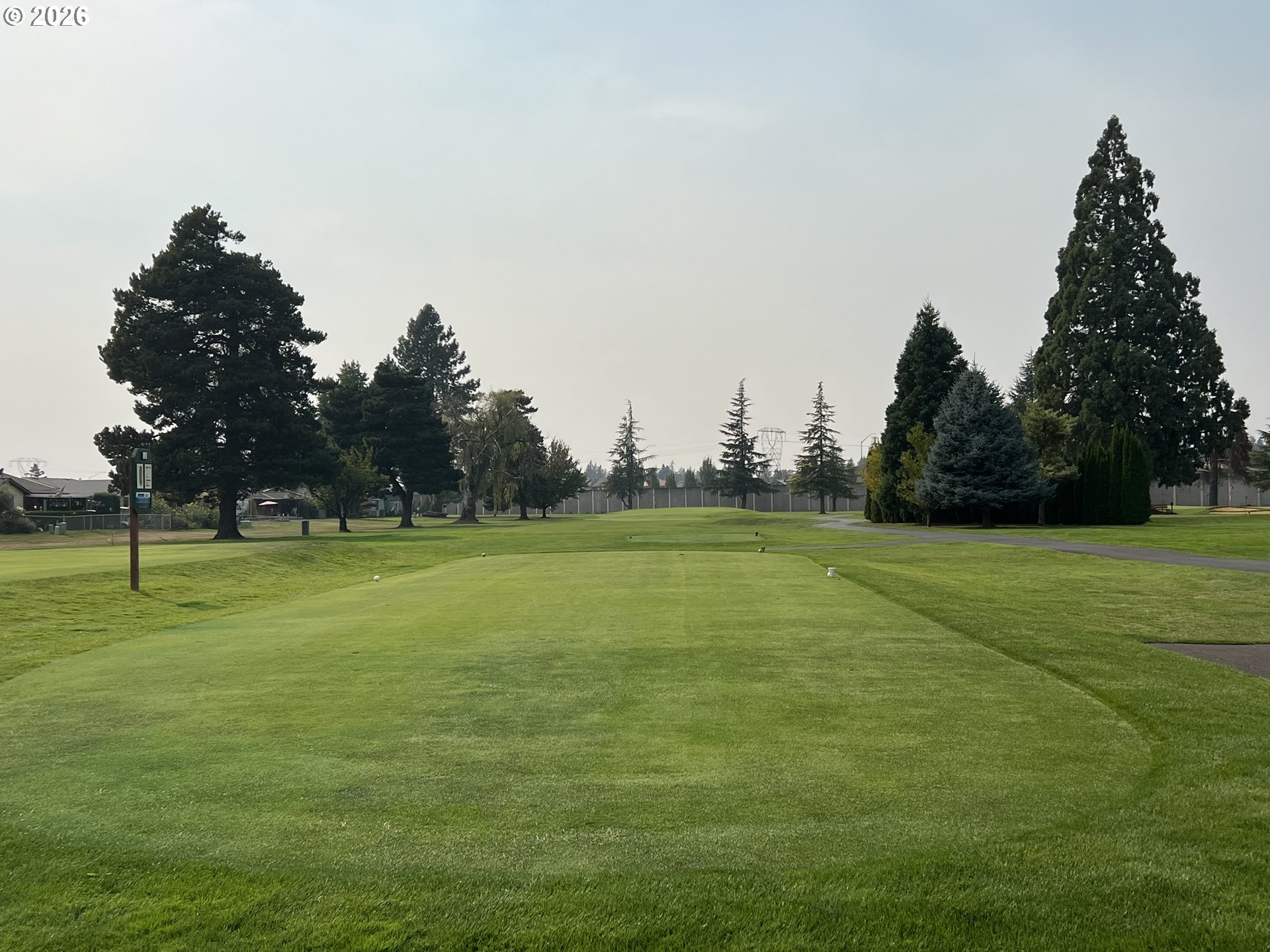 2130 Umpqua Road Woodburn, OR 97071 - Photo 18 of 21 a view of a golf course with a lake