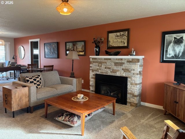 2130 Umpqua Road Woodburn, OR 97071 - Photo 2 of 21 a living room with furniture and a fireplace