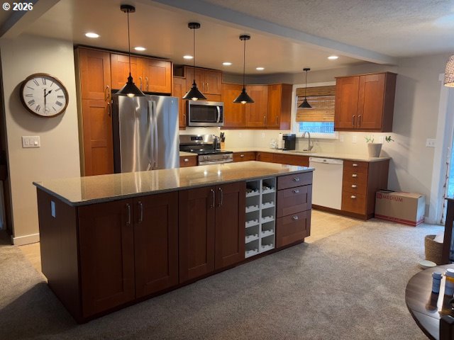 2130 Umpqua Road Woodburn, OR 97071 - Photo 5 of 21 a kitchen with stainless steel appliances granite countertop a stove a sink a refrigerator and a oven