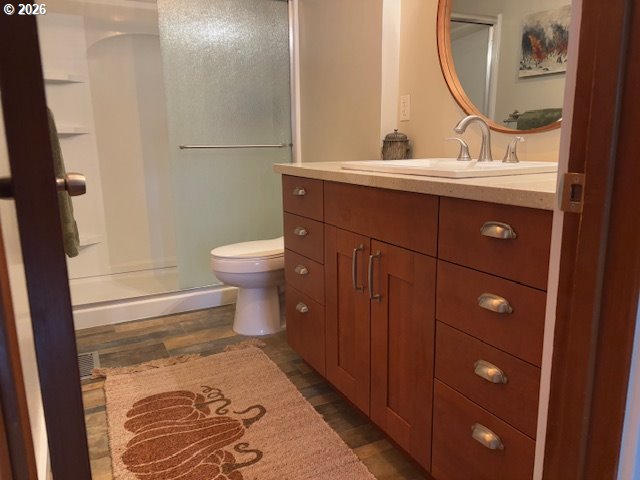 2130 Umpqua Road Woodburn, OR 97071 - Photo 9 of 21 a bathroom with a toilet sink and mirror