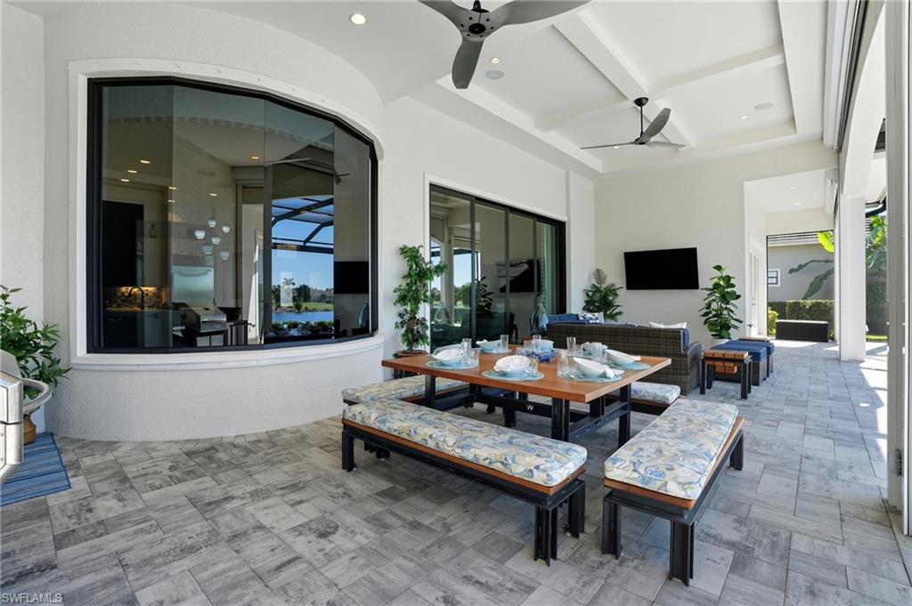 9177 Esplanade Boulevard Naples, FL 34119 - Photo 36 of 50 View of patio / terrace with ceiling fan, outdoor dining space, and an outdoor hangout area