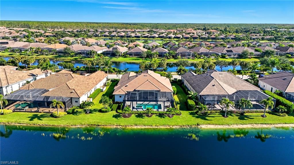 9177 Esplanade Boulevard Naples, FL 34119 - Photo 46 of 50 Aerial view of residential area featuring a large body of water