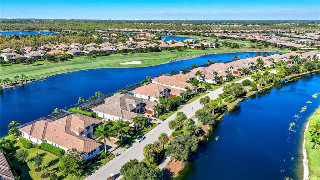 9177 Esplanade Boulevard Naples, FL 34119 - Photo 6 of 50 Aerial view of residential area with a golf course and a nearby body of water