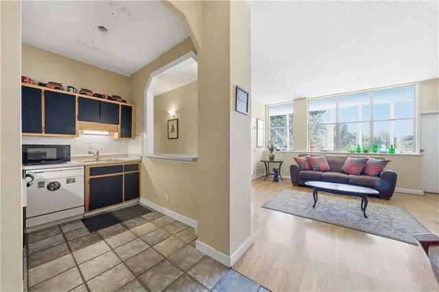 a kitchen with a refrigerator and a sink